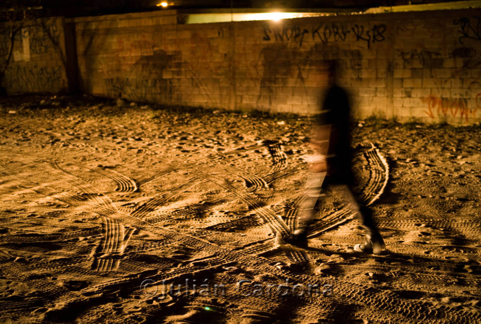 Figure on dirt with tire tracks, Juárez, 2008