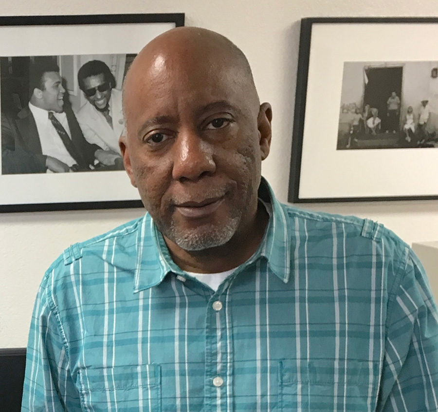 Keith Rice in a suit and looking at the camera.
