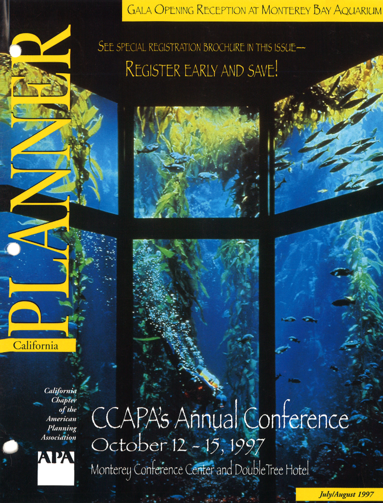 Magazine cover with one viewing an oceanic scene behind glass windows.