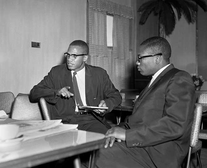 Gentlemen discussing at a table