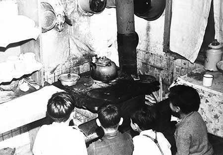 Children in front of an oven