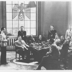 Film still of men in a room from Confessions of a Nazi Spy 3