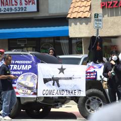Truck with Trump and 2nd amendment banners fixed to the side: COME AND TAKE IT