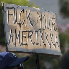 Handmade sign: FUCK YOUR AMERIKKKA