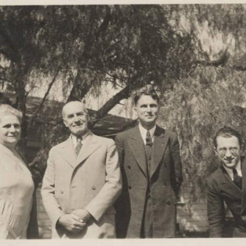 Photograph of people standing outdoors