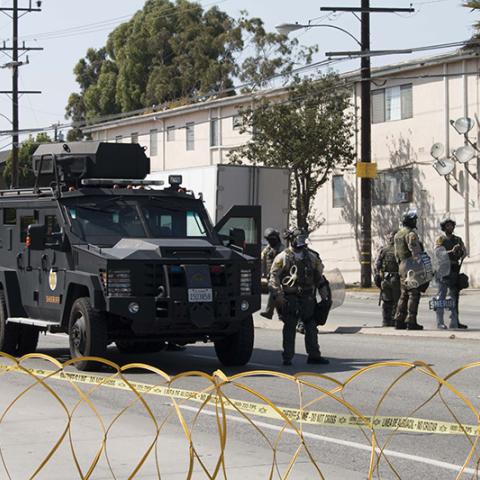Armored vehicle with officers on the street
