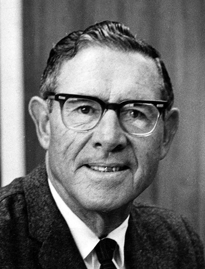 Portrait of man in suit and glasses