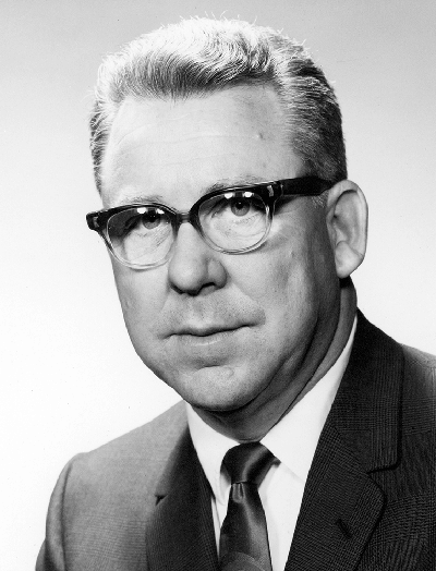 Portrait of man in suit and glasses