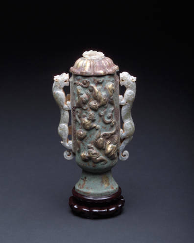 Ritual vessel. Bronze body with gold dragons inlaid and carved jade handles.